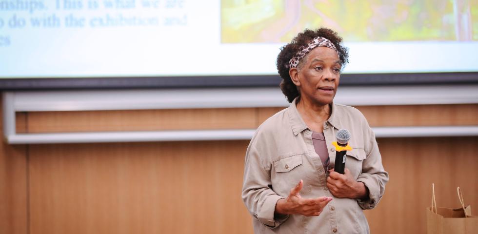 Dr. Peggy Blood is talking to the audience