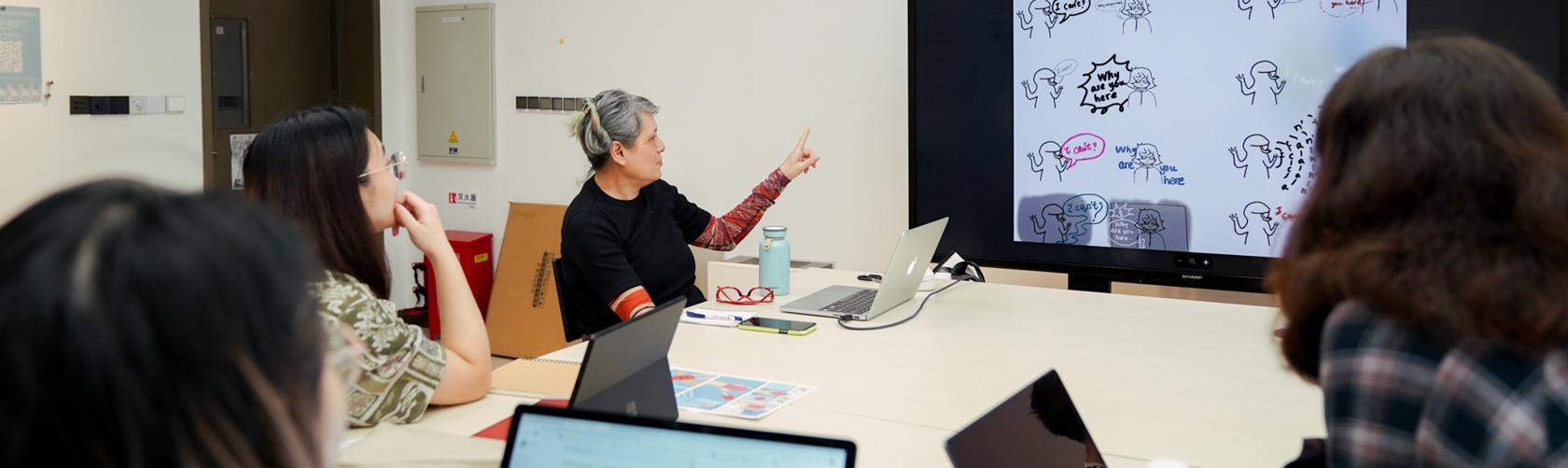 Monika lin presenting to students
