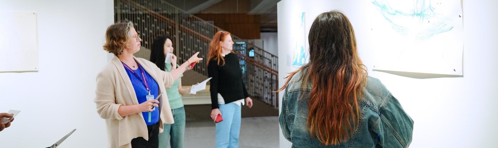 Maya Kramer discussing artwork with students