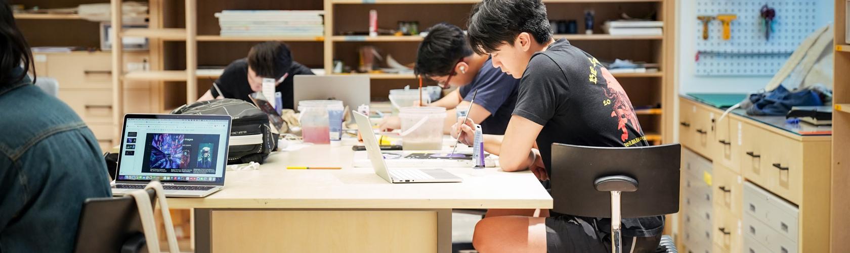 students working in the studio space